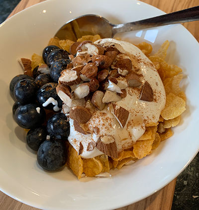 cornflakes with blueberries, yoghurt and nuts