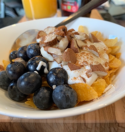 cornflakes with blueberries yoghurt and nuts